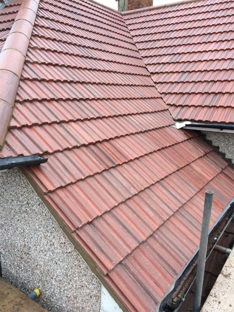 image of a red tiled roof what has just been completed